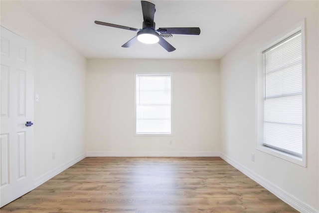 unfurnished room with ceiling fan and light hardwood / wood-style flooring