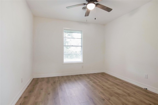 spare room with ceiling fan and light hardwood / wood-style floors