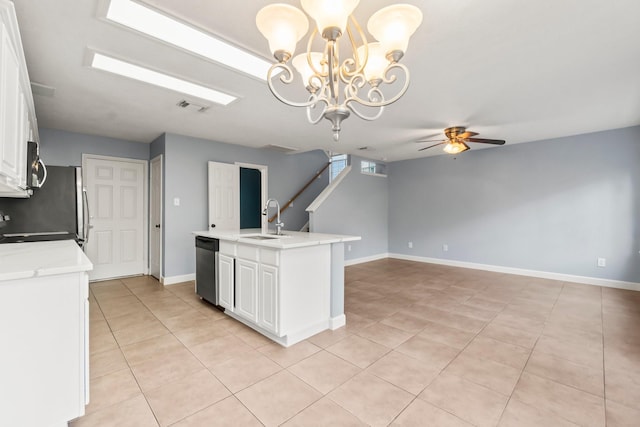 kitchen featuring ceiling fan with notable chandelier, sink, pendant lighting, dishwasher, and white cabinets