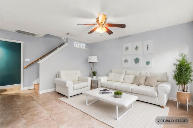 tiled living room with ceiling fan