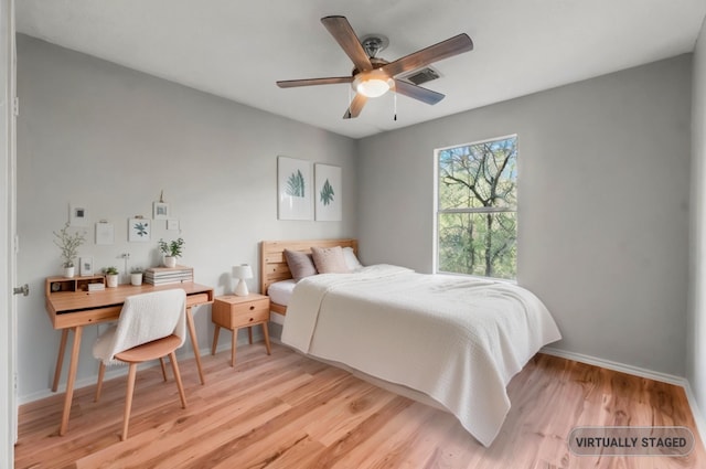 bedroom with ceiling fan and light hardwood / wood-style flooring