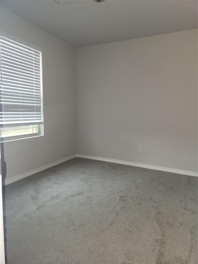 unfurnished room featuring carpet floors