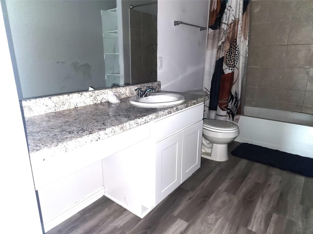 full bathroom with toilet, wood-type flooring, vanity, and shower / tub combo with curtain