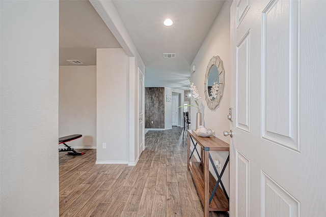 corridor featuring light hardwood / wood-style flooring