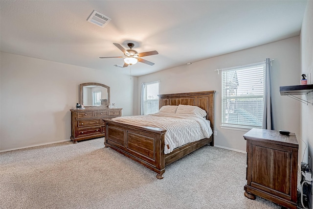 bedroom with light carpet and ceiling fan