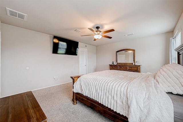 bedroom with ceiling fan and carpet floors