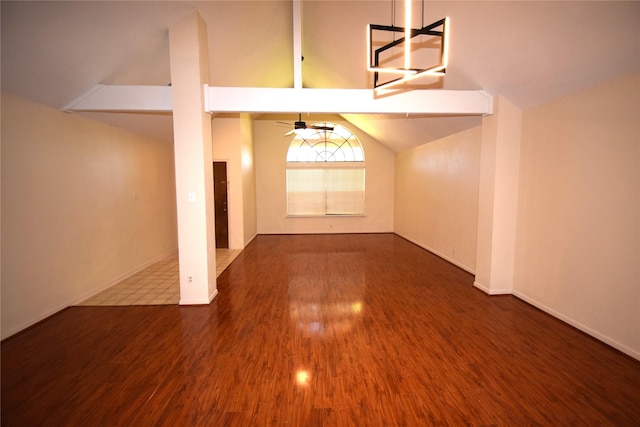 unfurnished living room featuring ceiling fan, high vaulted ceiling, and wood-type flooring