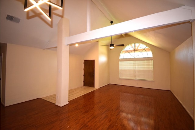 spare room with wood-type flooring, high vaulted ceiling, ceiling fan, and beam ceiling