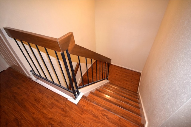 stairs with wood-type flooring