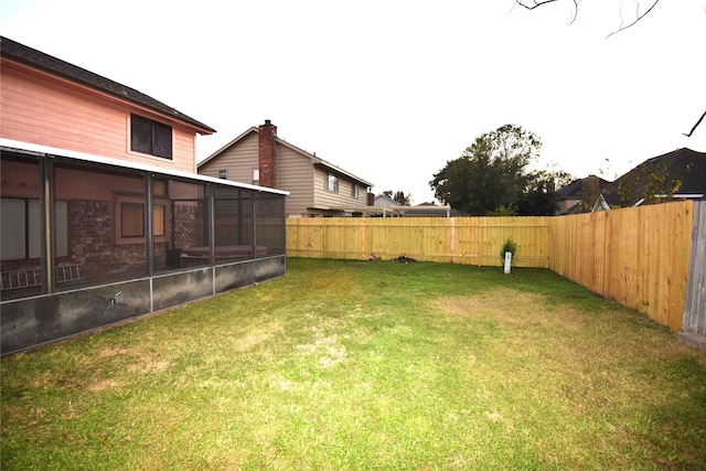 view of yard featuring a sunroom