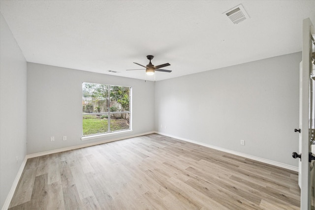 unfurnished room featuring ceiling fan and light wood-type flooring