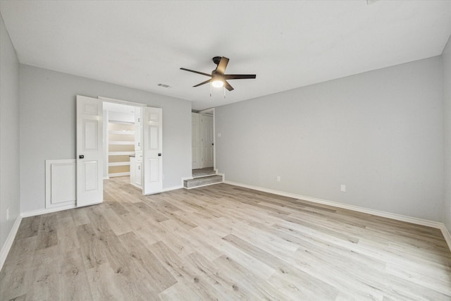 unfurnished bedroom featuring ceiling fan and light hardwood / wood-style flooring