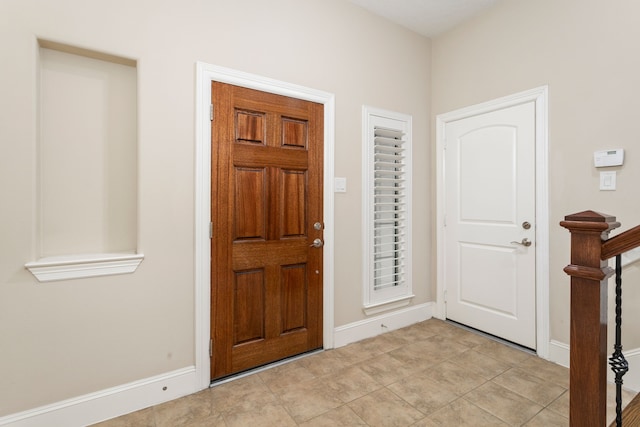 foyer with light tile patterned floors