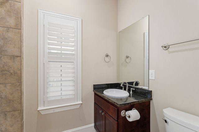 bathroom with vanity and toilet