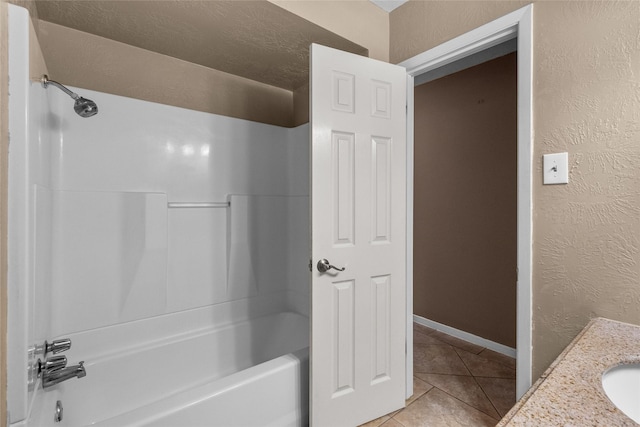 bathroom with tile patterned flooring, vanity, and bathing tub / shower combination