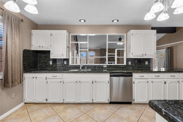 kitchen featuring dishwasher, white cabinetry, hanging light fixtures, and sink