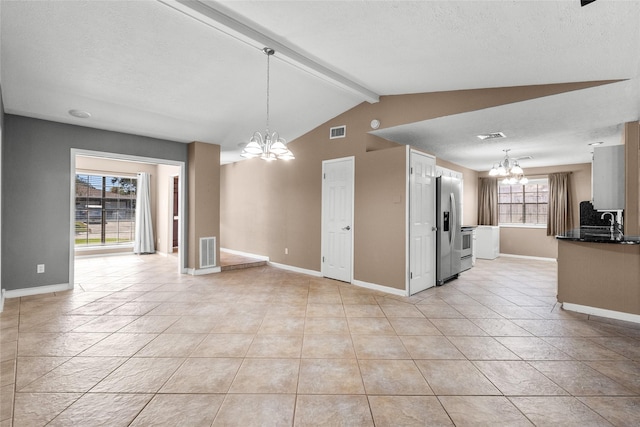 interior space with stainless steel fridge with ice dispenser, lofted ceiling with beams, an inviting chandelier, and hanging light fixtures