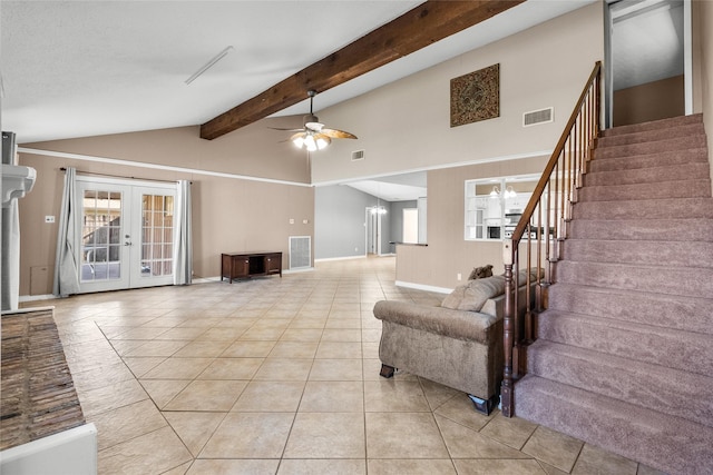 tiled living room with vaulted ceiling with beams, ceiling fan, and french doors