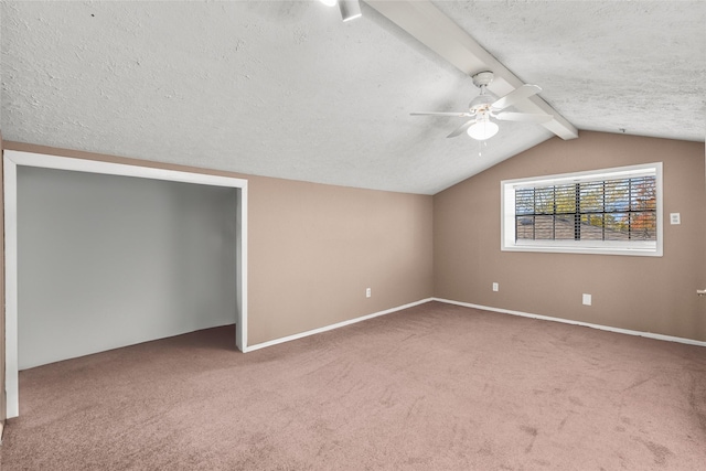 bonus room featuring vaulted ceiling with beams, ceiling fan, carpet, and a textured ceiling