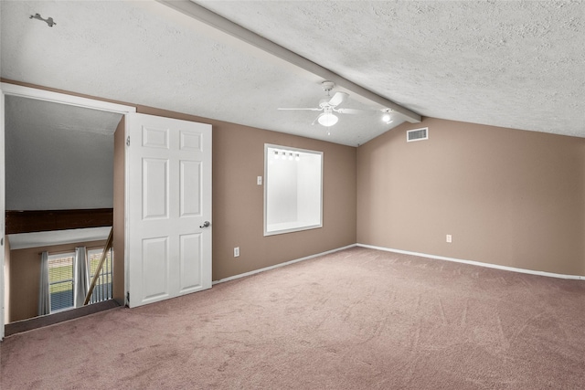 bonus room with a textured ceiling, lofted ceiling with beams, carpet floors, and ceiling fan