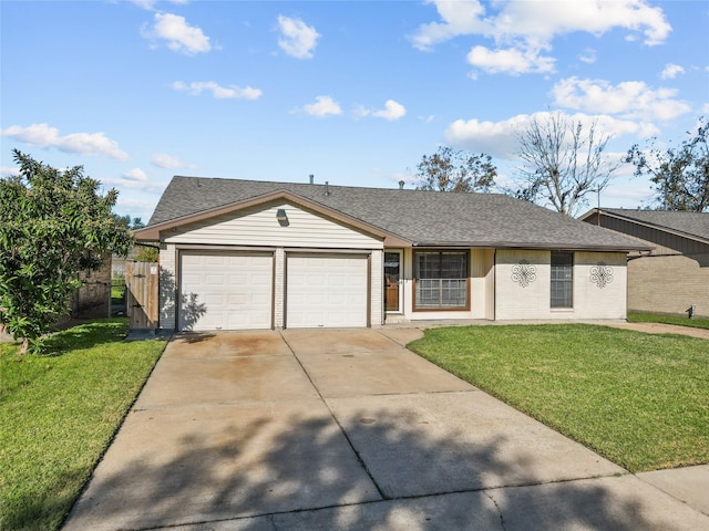 ranch-style house with a garage and a front lawn