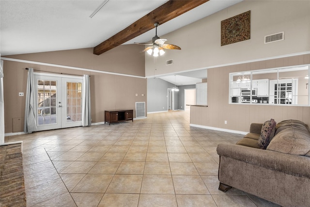 tiled living room featuring french doors, ceiling fan with notable chandelier, and lofted ceiling with beams