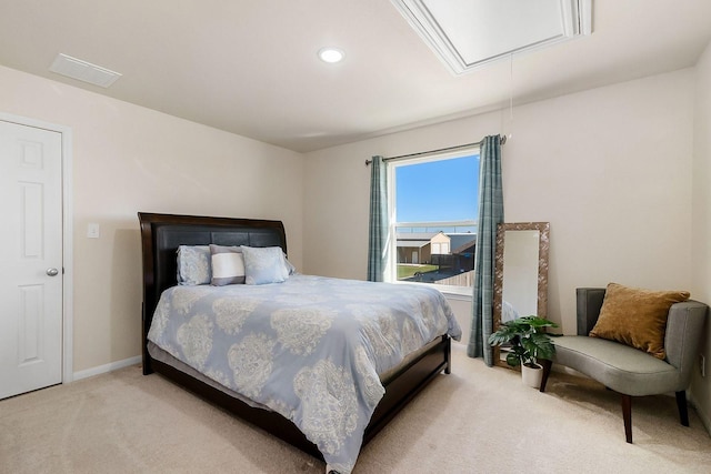 bedroom with light colored carpet