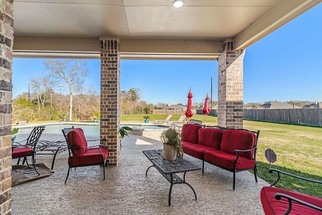 view of patio featuring a fenced in pool and an outdoor living space