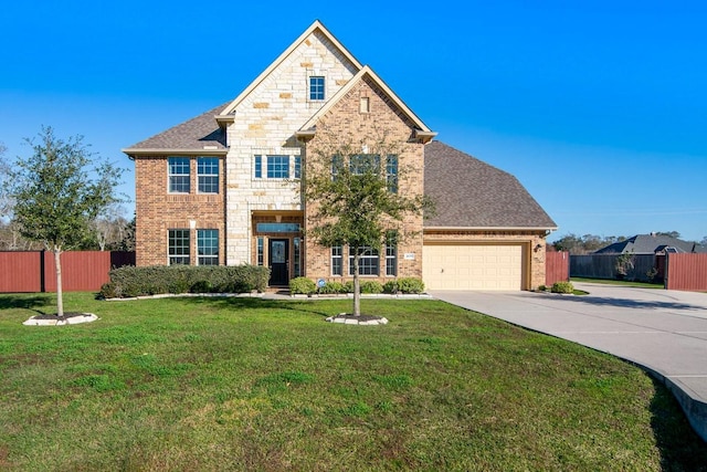 view of front of house with a garage and a front yard