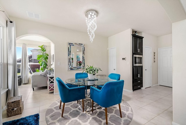 dining space featuring light tile patterned flooring