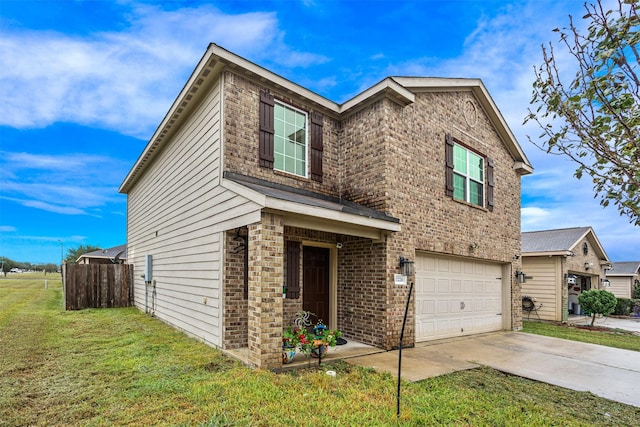 view of front of property with a garage and a front yard