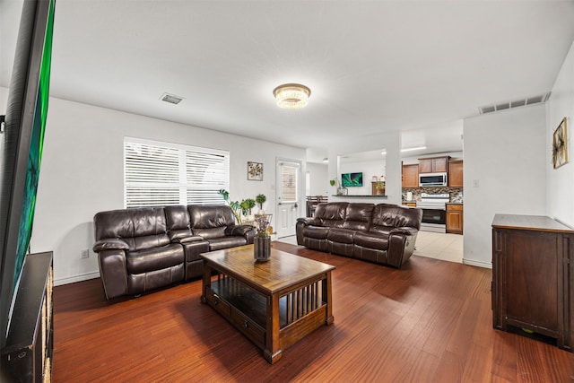 living room with dark hardwood / wood-style flooring