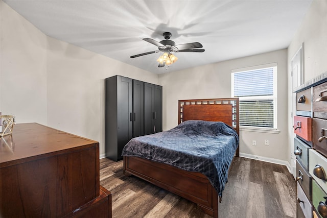 bedroom featuring ceiling fan and dark wood-type flooring