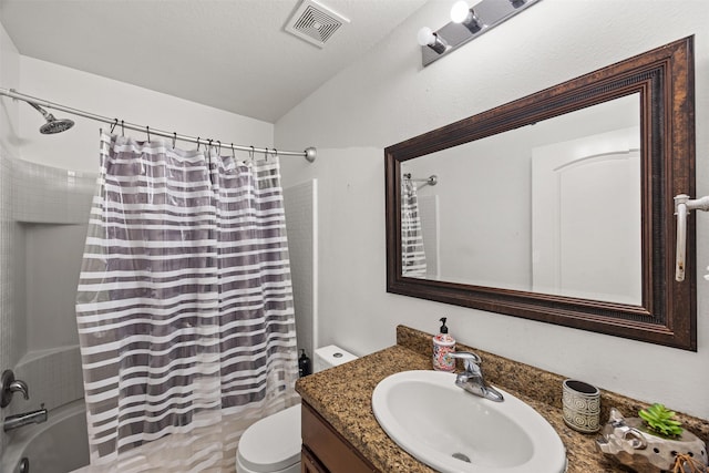 full bathroom featuring shower / bath combo, toilet, a textured ceiling, and vanity