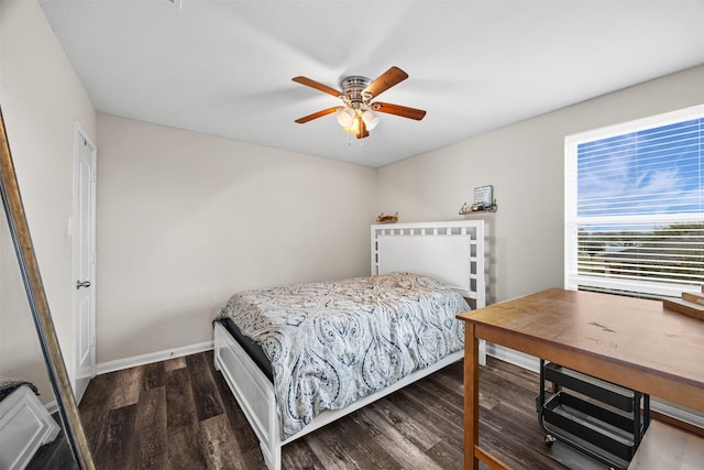 bedroom featuring dark hardwood / wood-style floors and ceiling fan