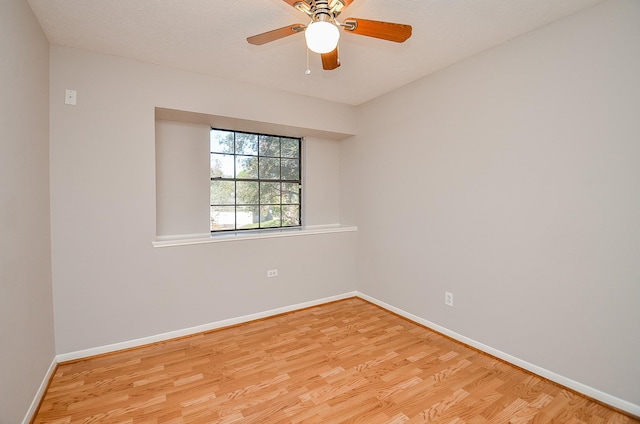 unfurnished room with ceiling fan and light hardwood / wood-style floors