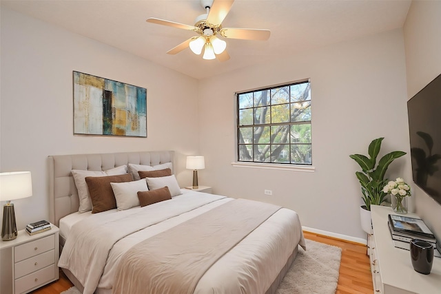 bedroom featuring light wood-type flooring and ceiling fan