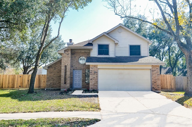 view of front of home featuring a front yard and a garage