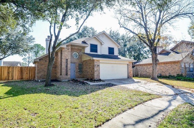 view of property with a front yard and a garage