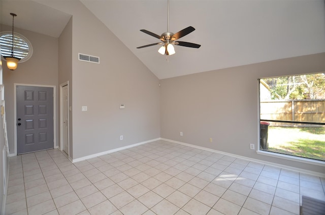 unfurnished room with high vaulted ceiling, ceiling fan, and light tile patterned flooring