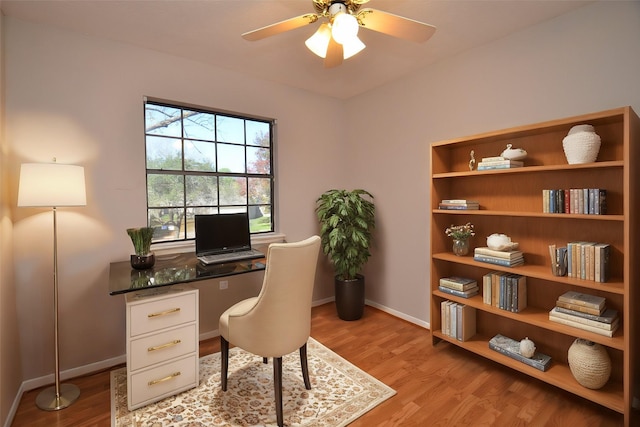 office space featuring ceiling fan and light hardwood / wood-style floors