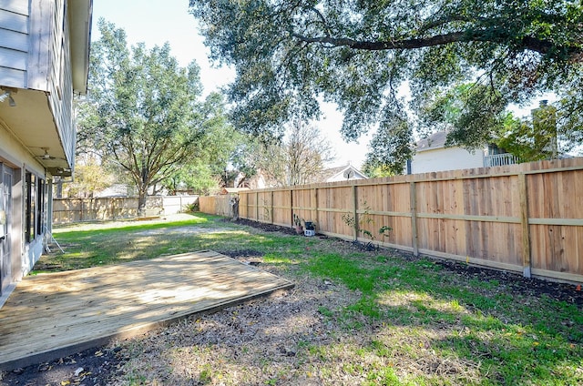 view of yard with a wooden deck