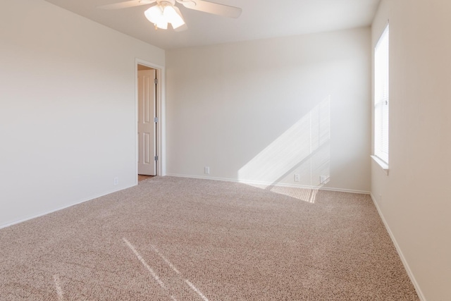 unfurnished room featuring carpet flooring and ceiling fan