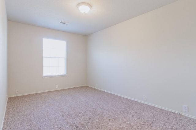 empty room with light colored carpet