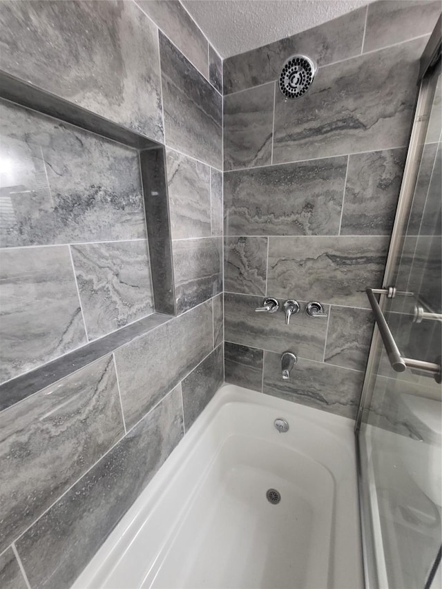 bathroom featuring a textured ceiling