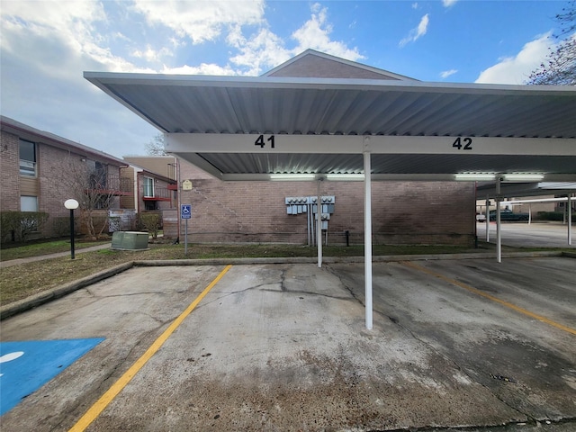 view of vehicle parking featuring a carport