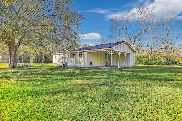 exterior space with a porch and a lawn