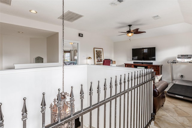 interior space featuring ceiling fan