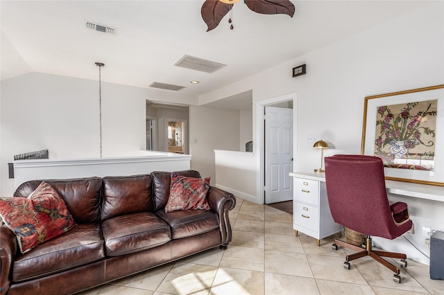 office with ceiling fan, lofted ceiling, and light tile patterned floors