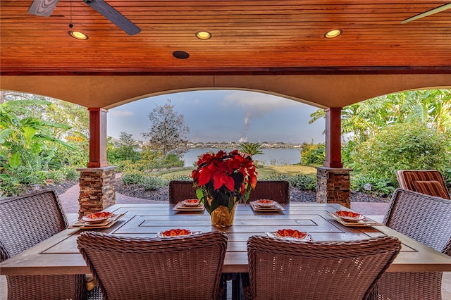 view of patio / terrace with a water view and ceiling fan